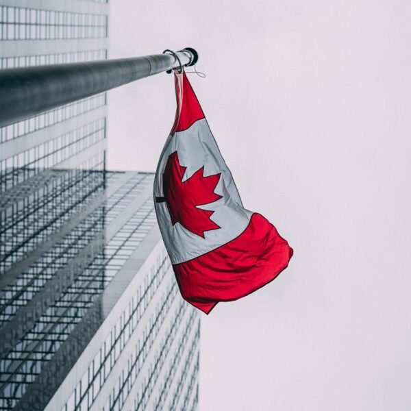 Canadian-Flag-in-front-of-Building