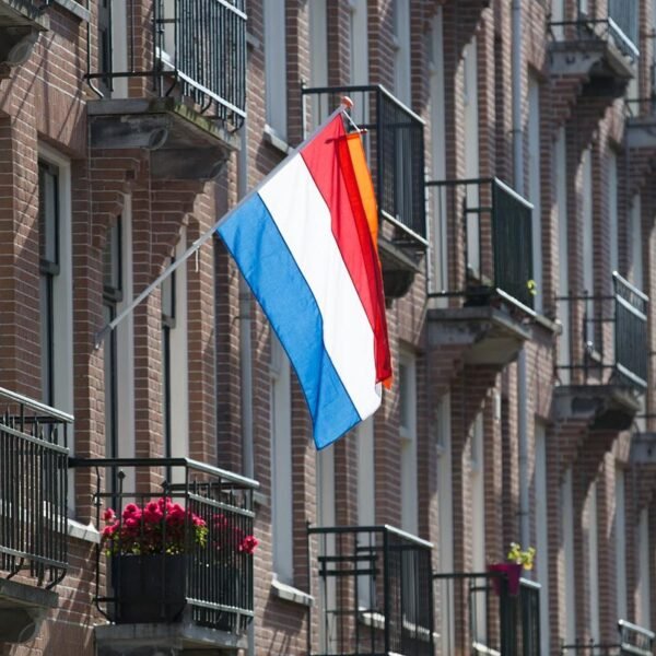 Dutch-Flag-Mounted-on-Building-with-An-Orange-Wimpel