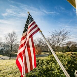 USA-Flag-Mounted-on-House-in-Yard