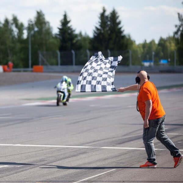 Man-waving-the-checkered-flag-at-the-finish-of-the-race